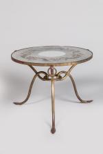 René Drouet (1899-1993) 
Table basse ronde à triple piétement en...