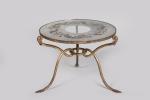 René Drouet (1899-1993) 
Table basse ronde à triple piétement en...